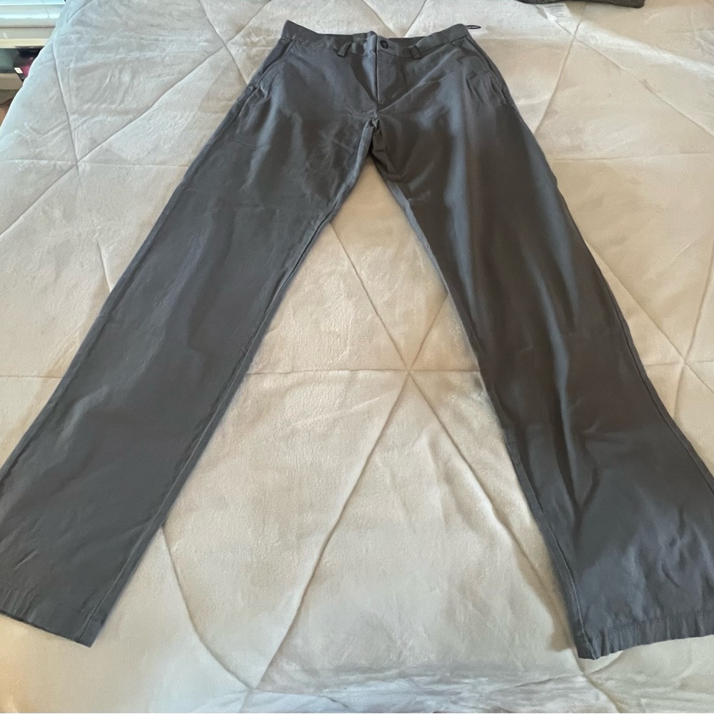 New with Tags.  Mens gray ultimate loose built in flex khakis.